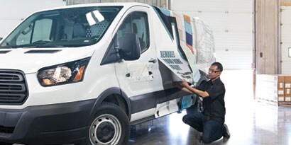 3M graphic wrap film being installed on a fleet van
