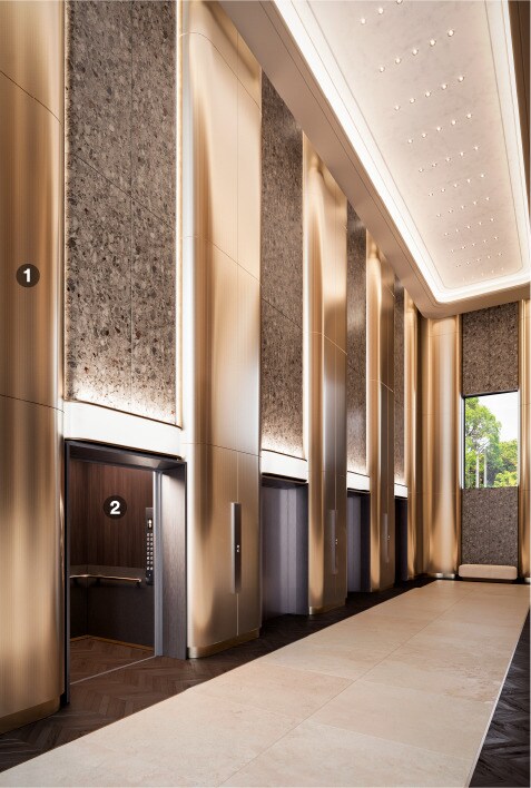 Vestíbulo del ascensor renovado con acabados arquitectónicos metálicos.
