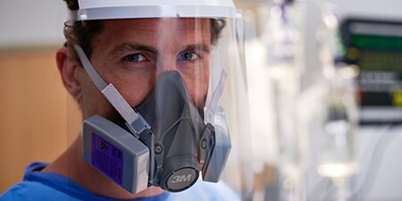 Clinician wearing a reusable respirator
