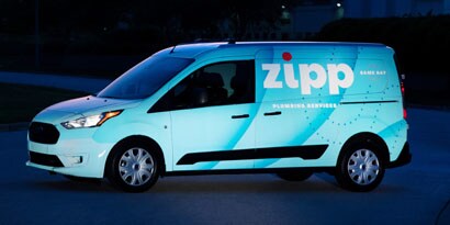 reflective car wrap on a fleet vehicle to give brand visibility during the day and night
